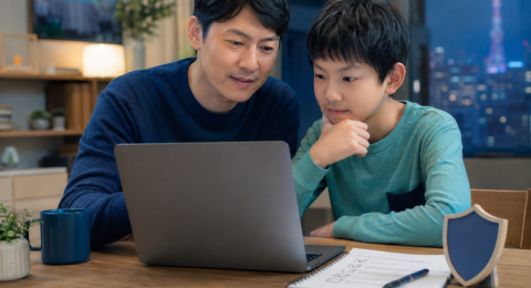 Parent guiding a child through safe and responsible AI use