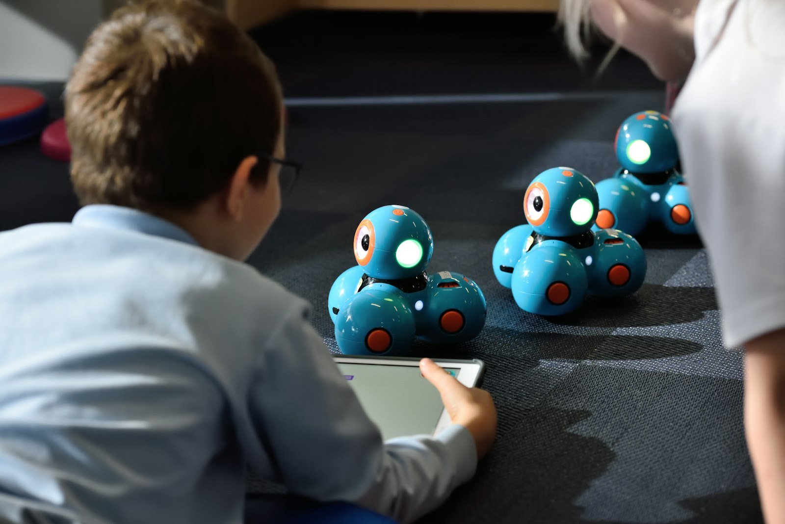 Boy using a tablet computer to explore learning options