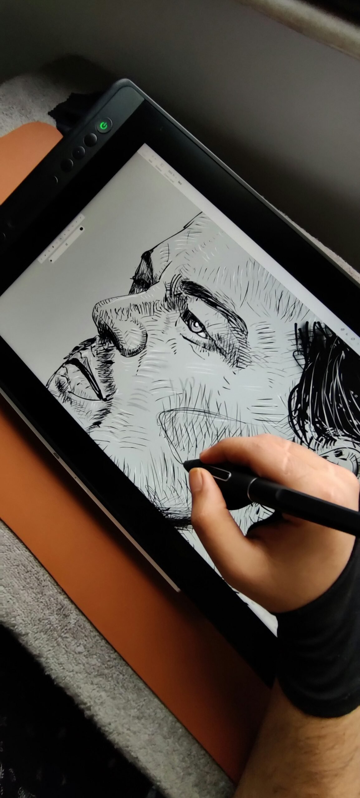 Person drawing digital art on a tablet with a stylus pen
